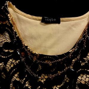 Peplum blouse with necklace